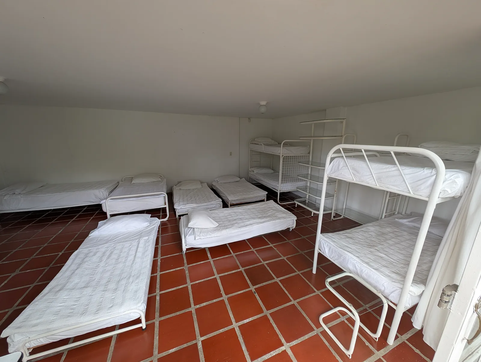 Large room with several beds